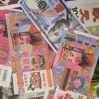 various colored joss paper notes spread out in a pile